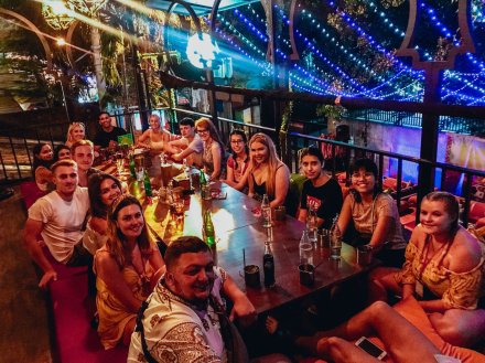 A group enjoying their welcome dinner on Khao San Road in Bangkok Thailand 