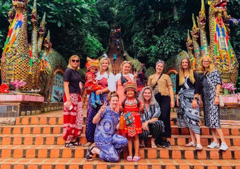 A group photo at the beginning of the 300 steps at Wat Phra That Doi Suthep in Chiang Mai Thailand